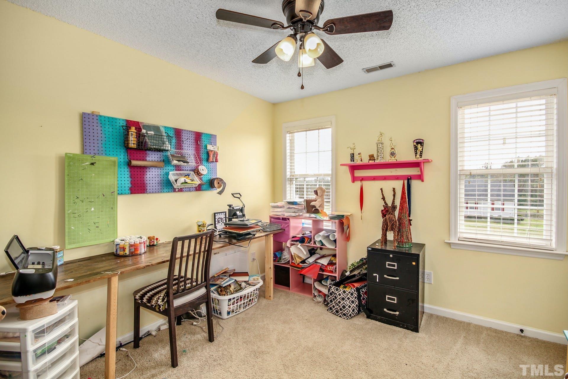 1013 Holland Ridge Drive Raleigh, NC 27603 - Photo 21 of 29 a view of a livingroom with furniture and a window