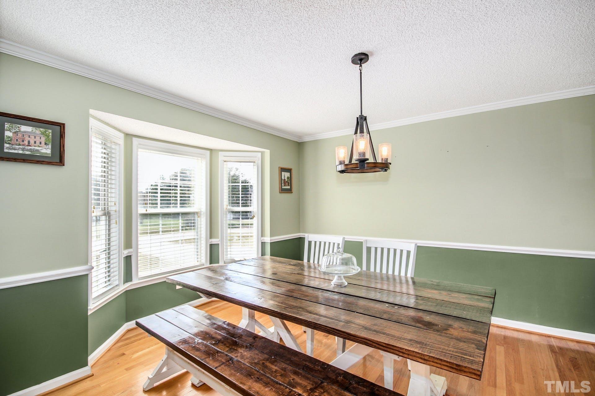 1013 Holland Ridge Drive Raleigh, NC 27603 - Photo 6 of 29 a living room with a bed furniture and a window