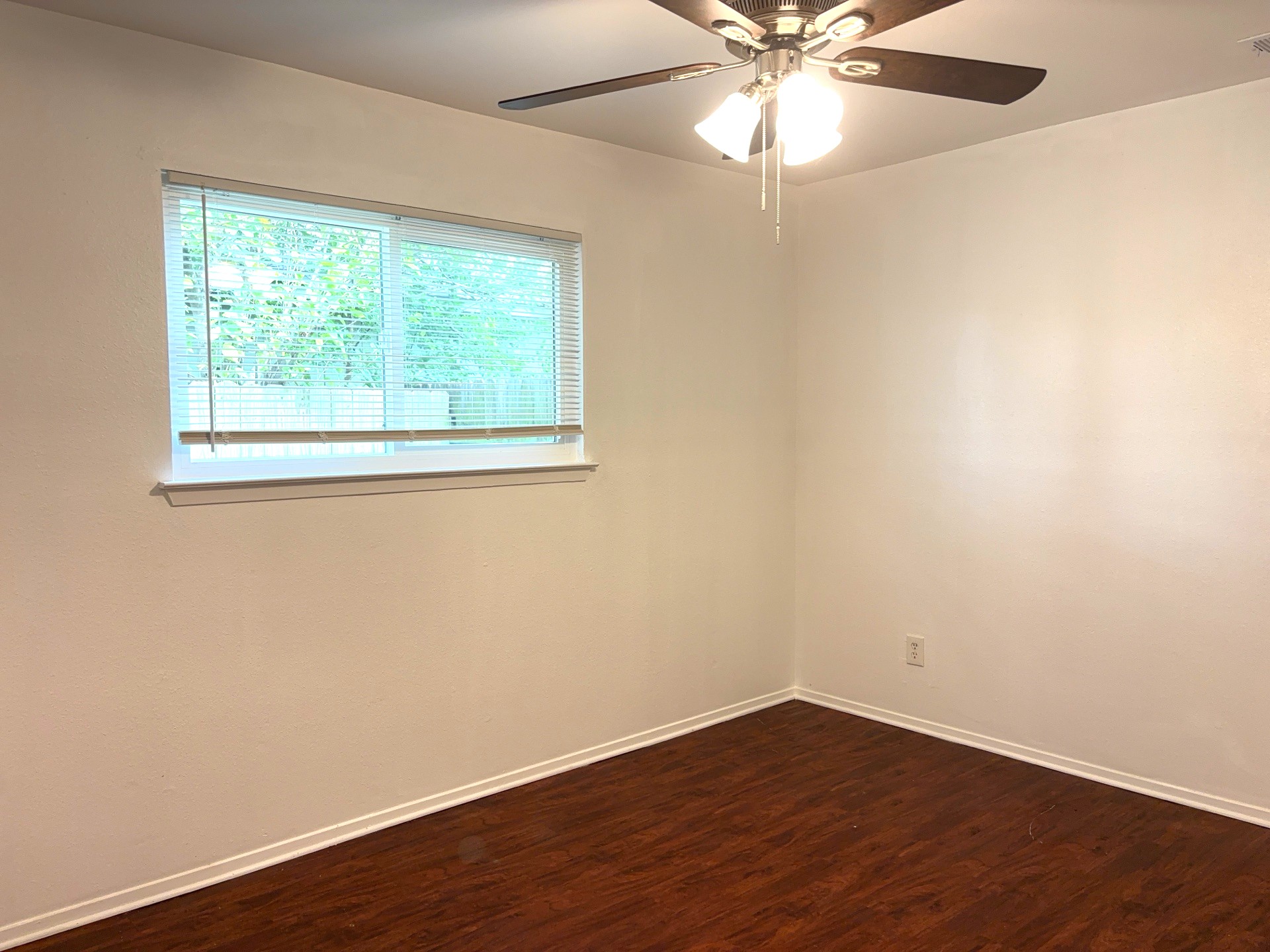16005 Stoneham Circle Pflugerville, TX 78660 - Photo 11 of 18 Unfurnished room featuring dark wood-type flooring and a ceiling fan