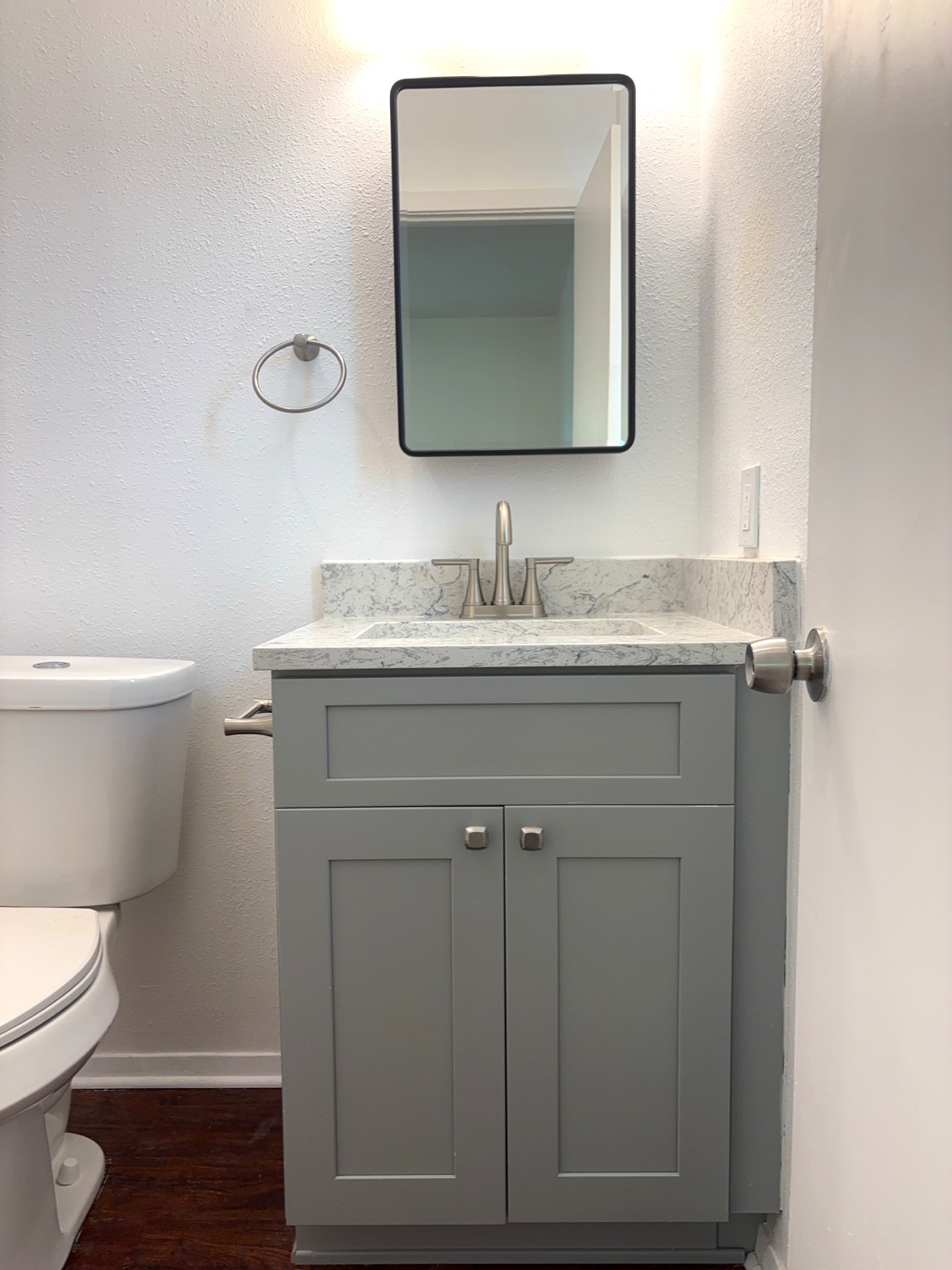 16005 Stoneham Circle Pflugerville, TX 78660 - Photo 12 of 18 Bathroom featuring vanity and wood finished floors