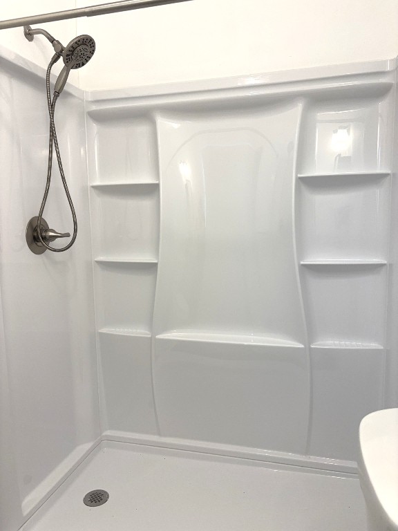 16005 Stoneham Circle Pflugerville, TX 78660 - Photo 13 of 18 a bathroom with a shower