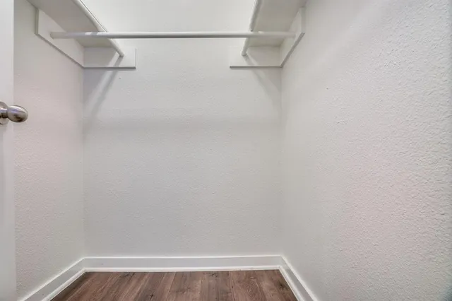 a view of a room with racks on the wall