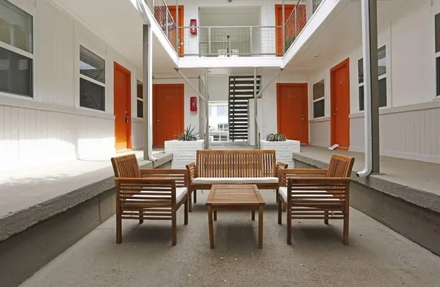 a dining room with furniture and window