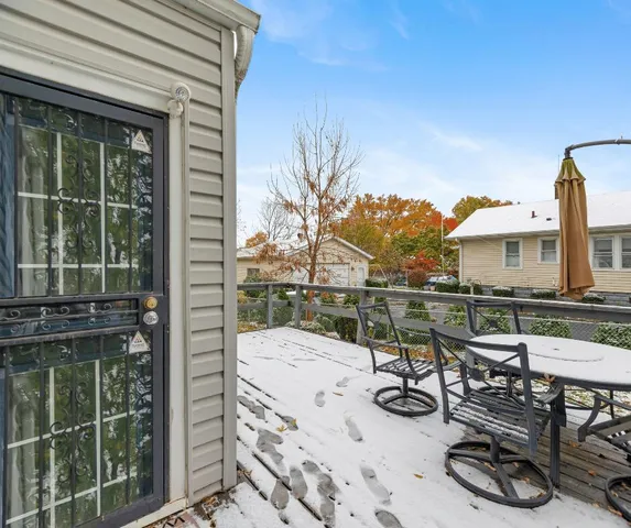 a view of a chairs and table in patio