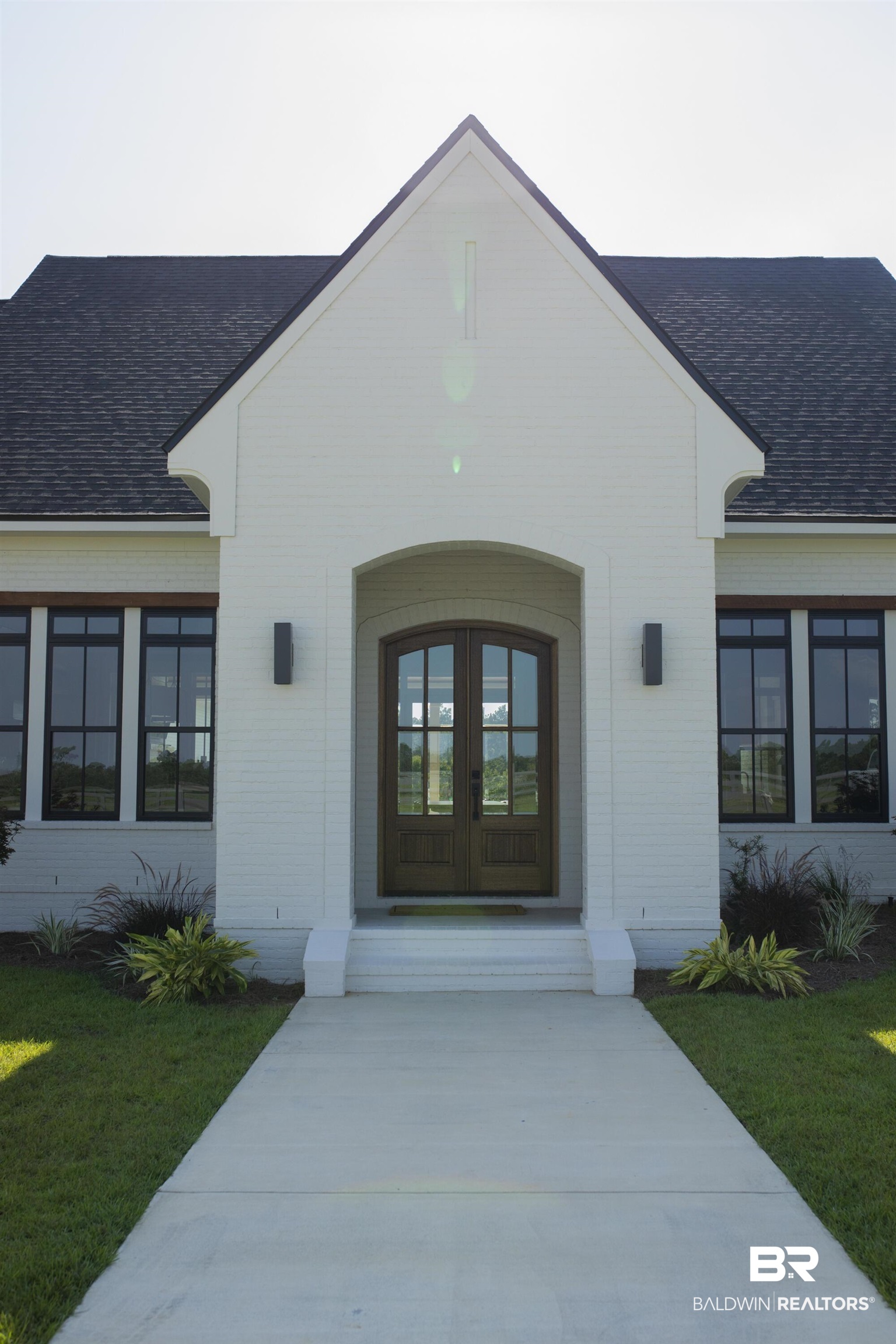 21767 Gallery Boulevard Fairhope, AL 36532 - Photo 2 of 74 Entrance to property with roof with shingles, brick siding, and french doors