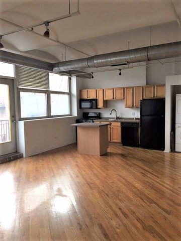 500 South Clinton Street, Unit 611 Chicago, IL 60607 - Photo 11 of 19 a kitchen with stainless steel appliances granite countertop a sink and cabinets