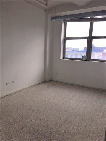 500 South Clinton Street, Unit 611 Chicago, IL 60607 - Photo 12 of 19 a view of an empty room with a window