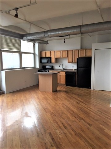 500 South Clinton Street, Unit 611 Chicago, IL 60607 - Photo 17 of 19 a kitchen with stainless steel appliances granite countertop a refrigerator and a stove top oven