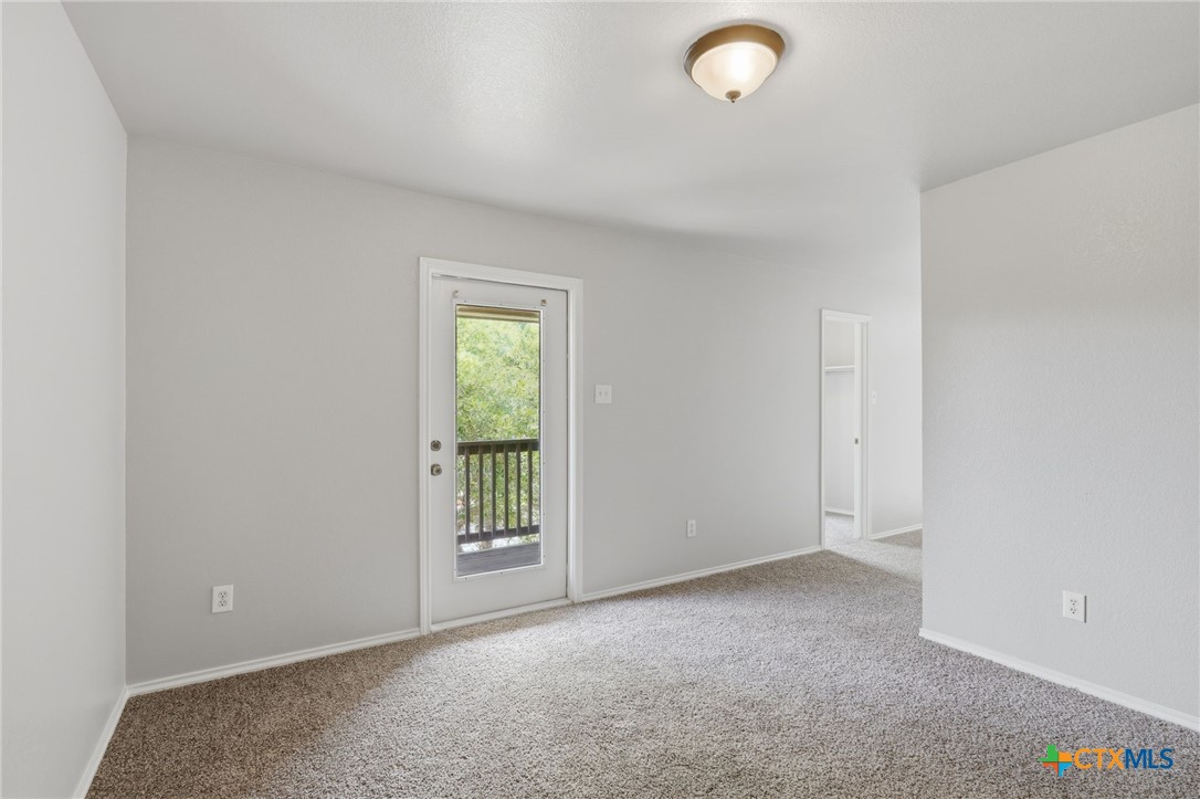 8716 Starview Street Temple, TX 76502 - Photo 15 of 36 Blank canvas bedroom with clean neutral carpets and bright natural light. Waiting for your to create your own room.