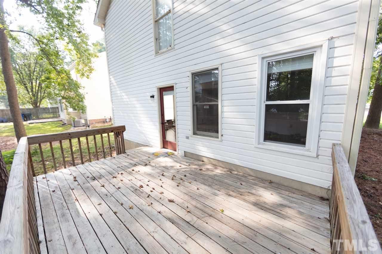 4713 Tolley Court Raleigh, NC 27616 - Photo 26 of 28 a view of a wooden balcony with a outdoor space