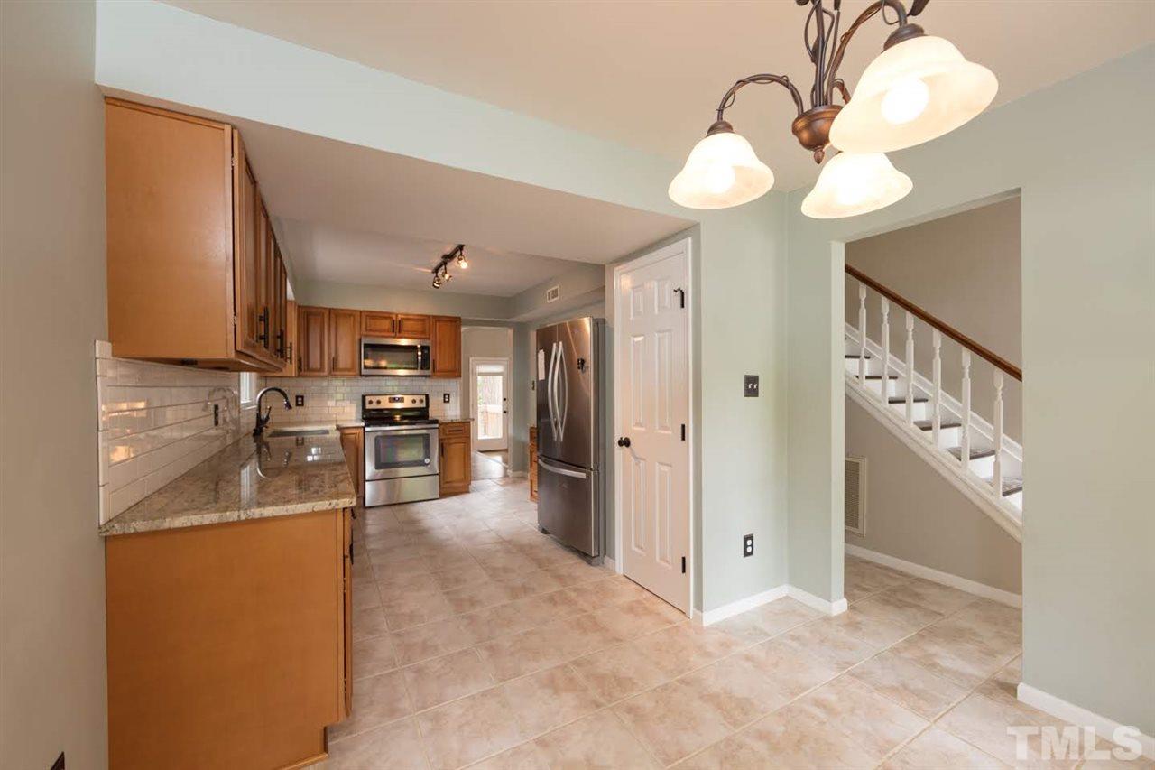 4713 Tolley Court Raleigh, NC 27616 - Photo 8 of 28 a view of a kitchen with a sink and cabinets