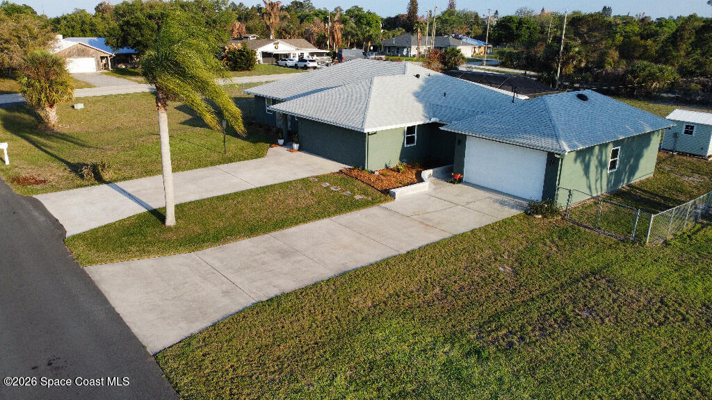9010 Central Avenue Sebastian, FL 32976 - Photo 1 of 18 a aerial view of a house with a yard