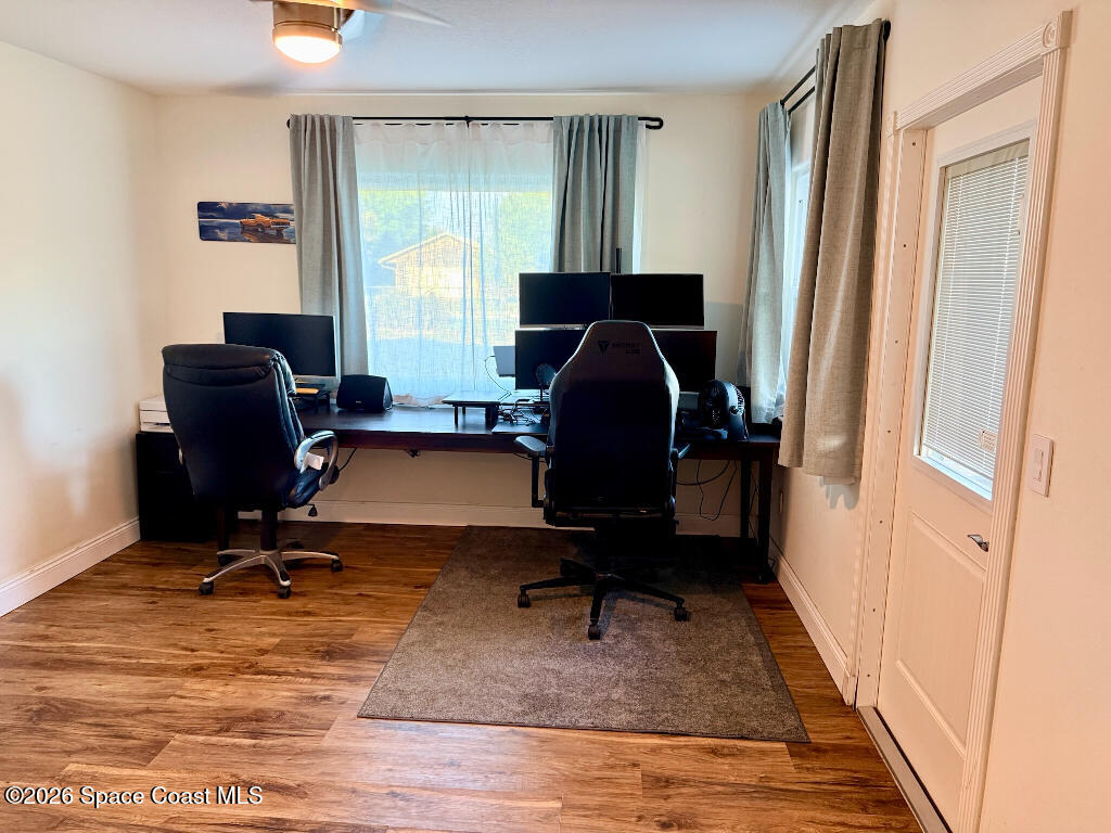 9010 Central Avenue Sebastian, FL 32976 - Photo 12 of 18 a view of a workspace with furniture and a window