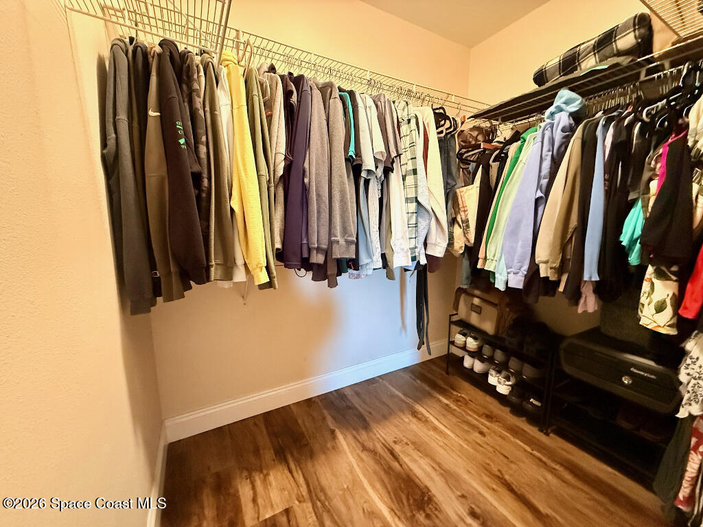 9010 Central Avenue Sebastian, FL 32976 - Photo 14 of 18 a view of walk in closet with clothes