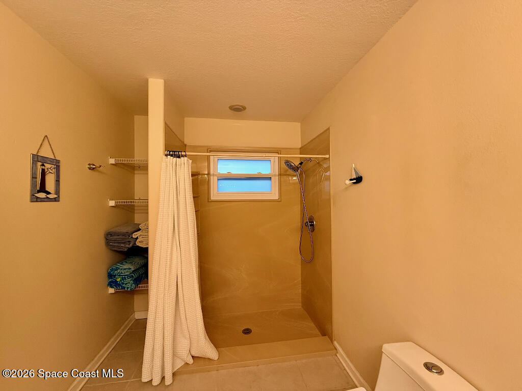 9010 Central Avenue Sebastian, FL 32976 - Photo 16 of 18 a bathroom with a shower