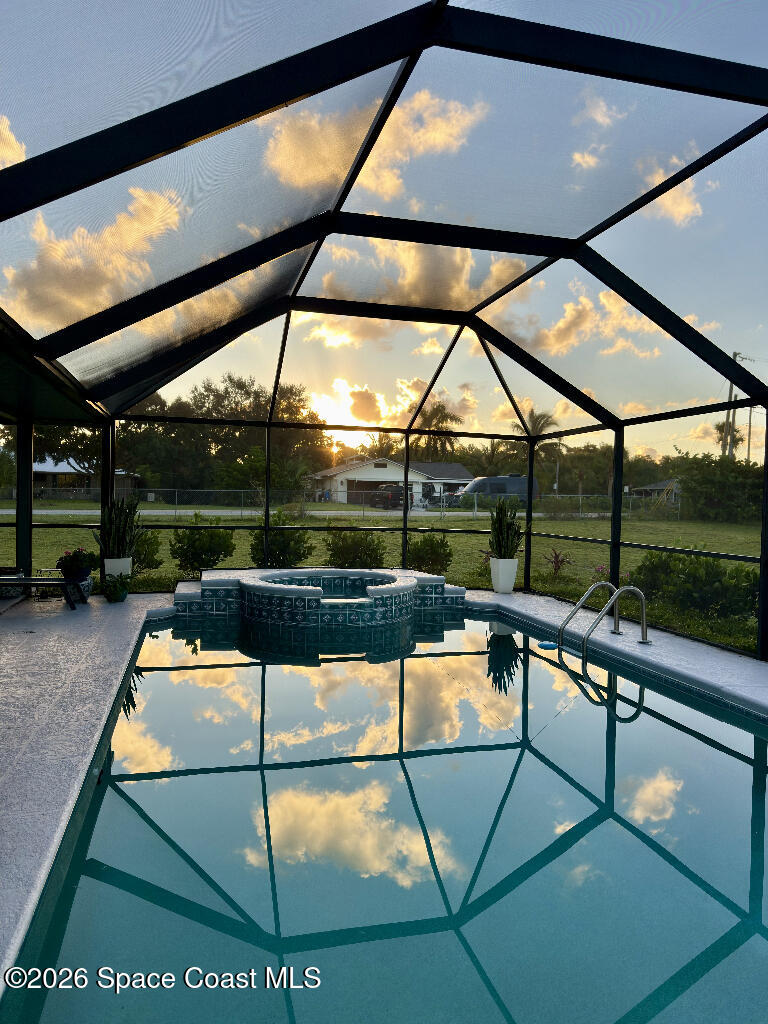 9010 Central Avenue Sebastian, FL 32976 - Photo 17 of 18 a view of a swimming pool with a patio