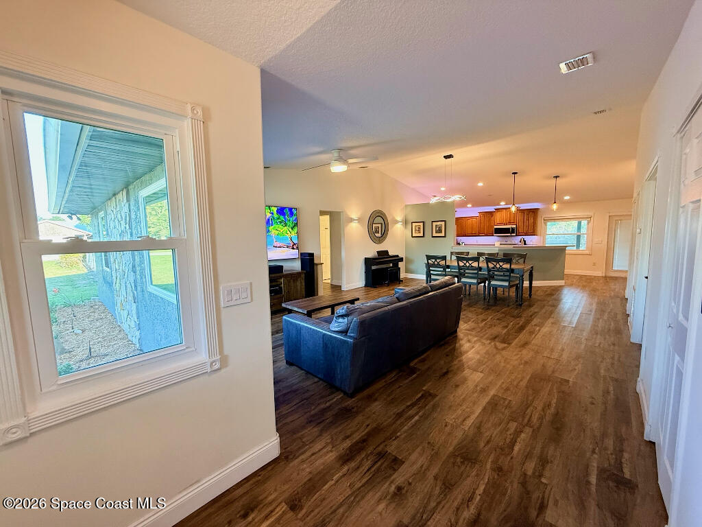 9010 Central Avenue Sebastian, FL 32976 - Photo 3 of 18 a living room with furniture and a wooden floor