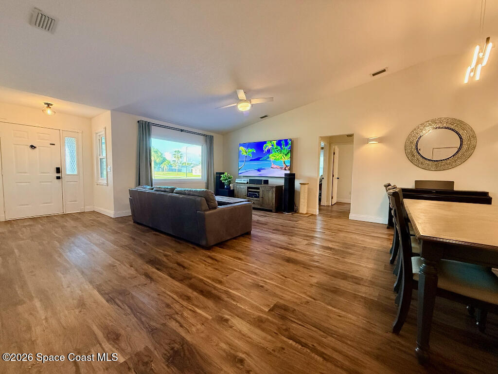 9010 Central Avenue Sebastian, FL 32976 - Photo 4 of 18 a living room with furniture and a flat screen tv