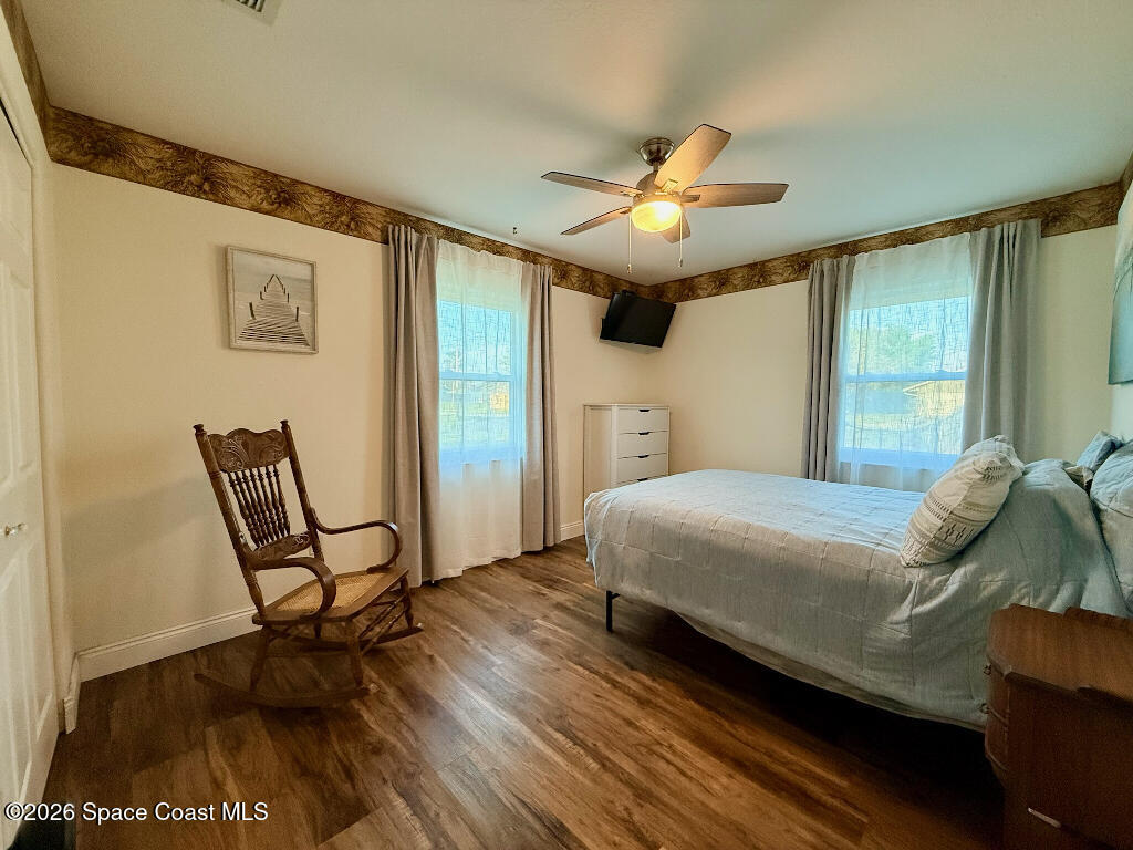 9010 Central Avenue Sebastian, FL 32976 - Photo 5 of 18 a bedroom with a bed chair and a window