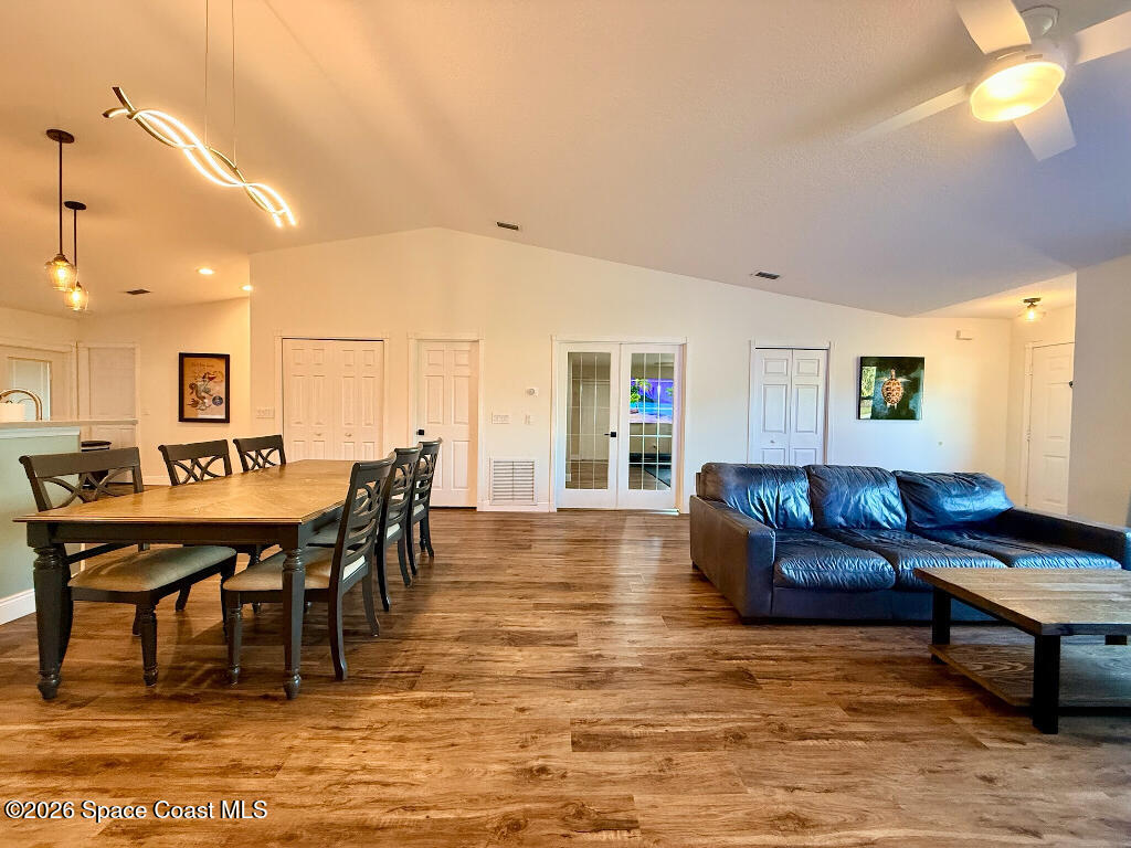 9010 Central Avenue Sebastian, FL 32976 - Photo 8 of 18 a living room with furniture a flat screen tv and a table