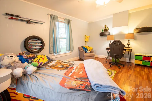 a bedroom with bed and a window