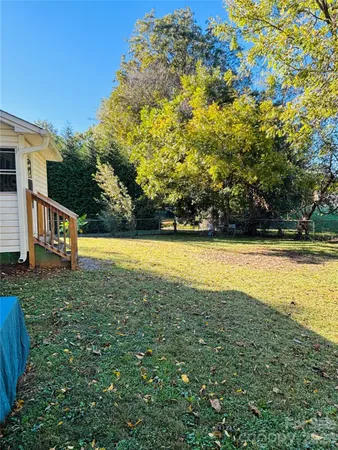 a front view of a house with a yard table and chairs