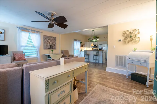 a view of living room with furniture and a flat screen tv