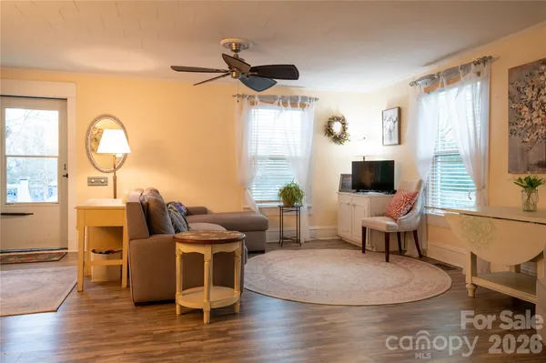 a living room with furniture and a flat screen tv