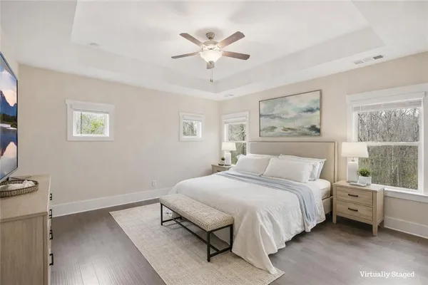 a bedroom with a bed and a fireplace