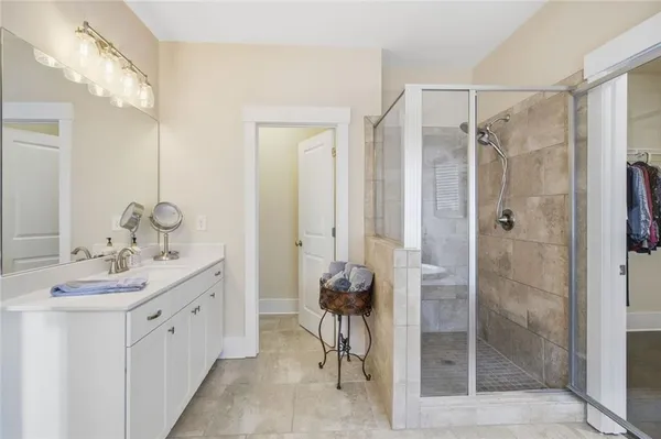 a bathroom with a glass door shower
