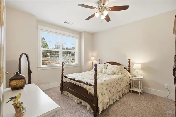 a living room with furniture pool table and windows
