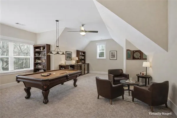 a dining room with furniture and wooden floor