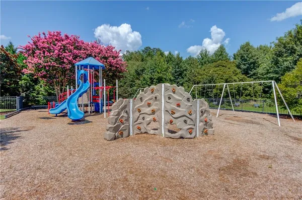 a view of a swimming pool with a yard