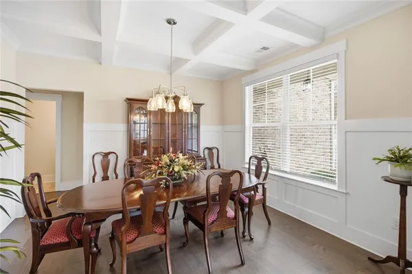 a living room with furniture a rug and a window