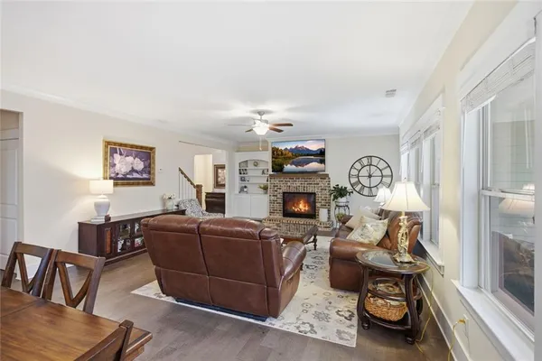 a dining room with kitchen island a table and chairs