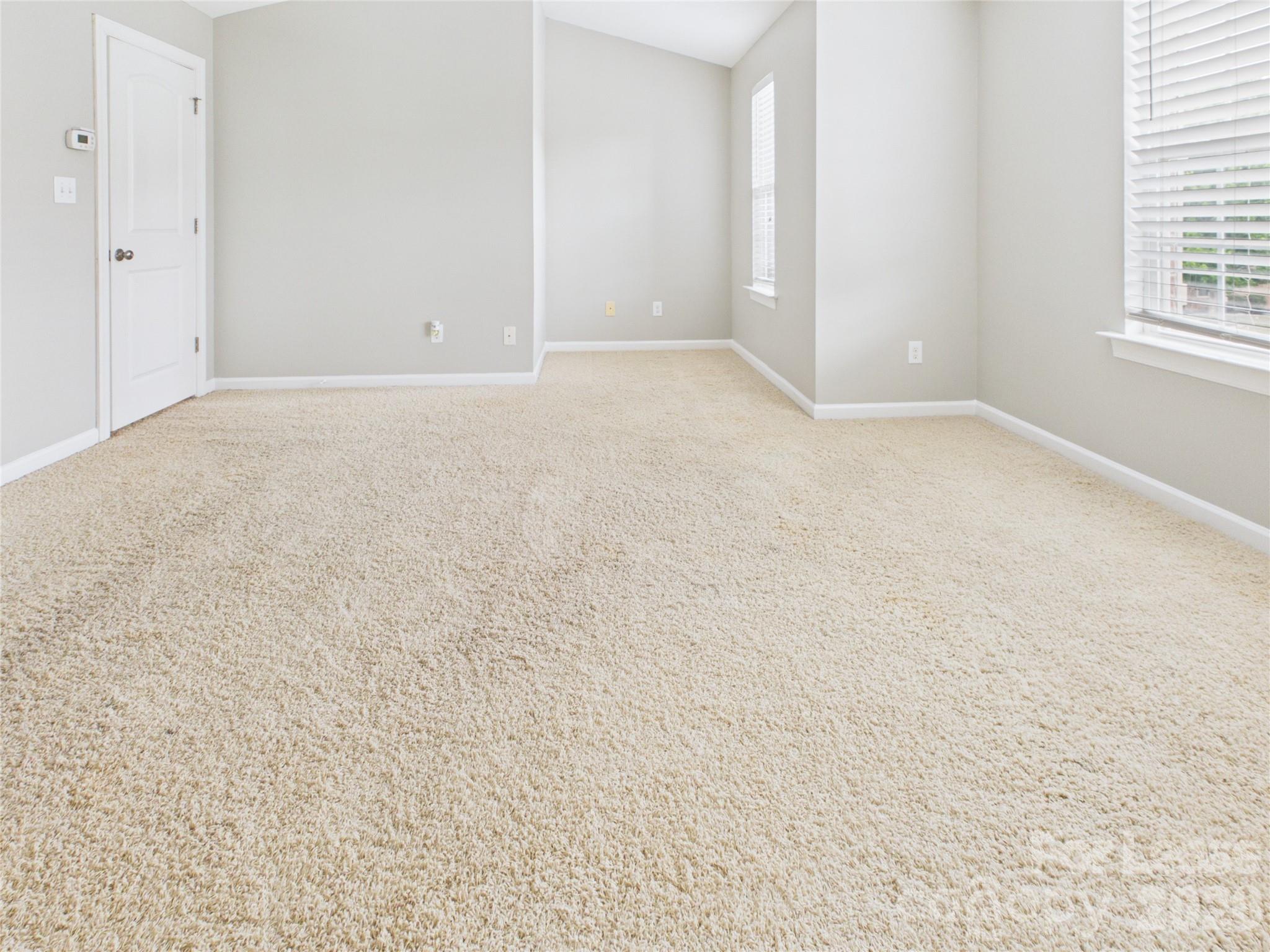 5690 Stafford Road Charlotte, NC 28215 - Photo 19 of 25 an empty room with windows