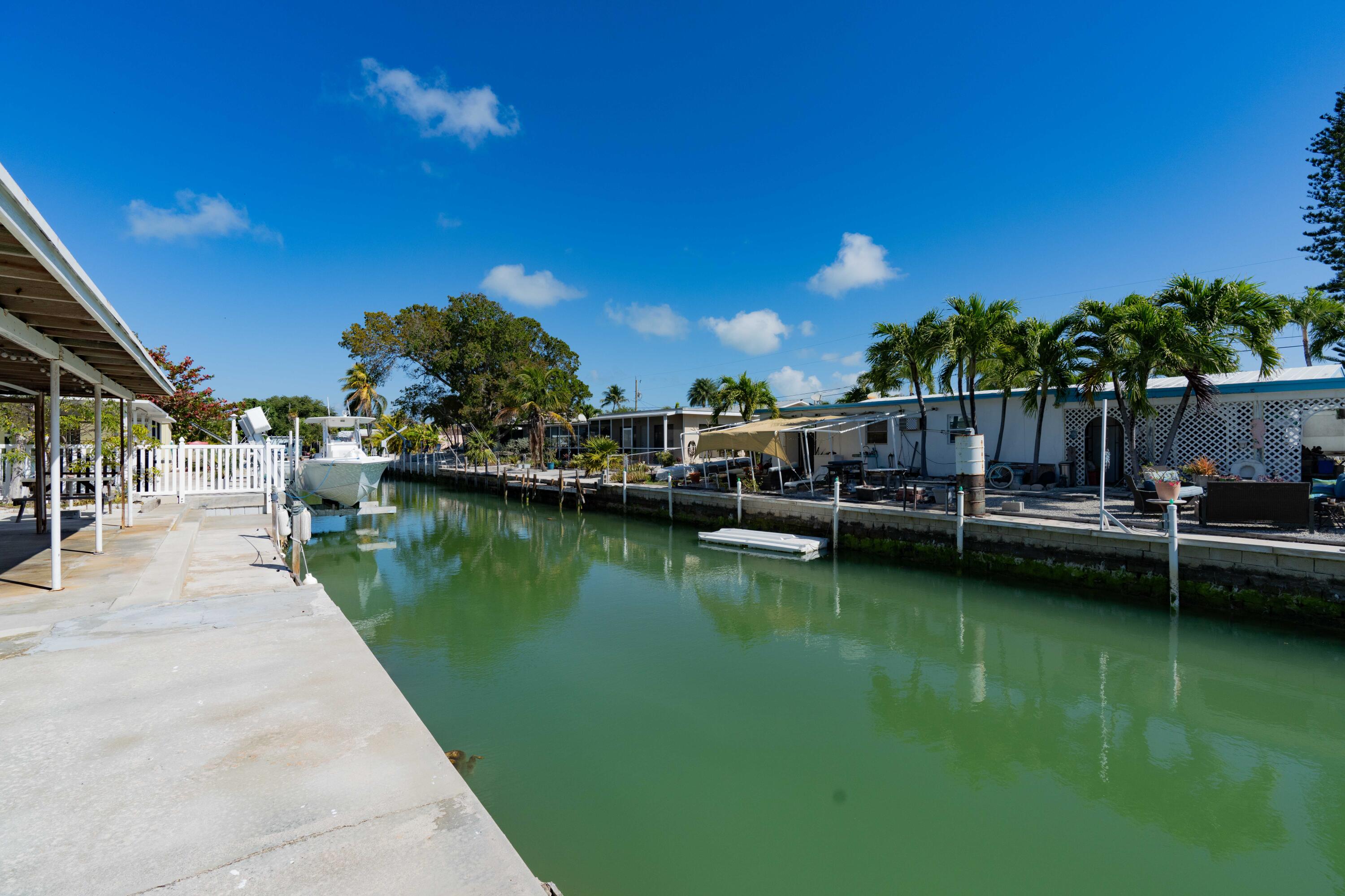 a view of swimming pool with outdoor seating and yard