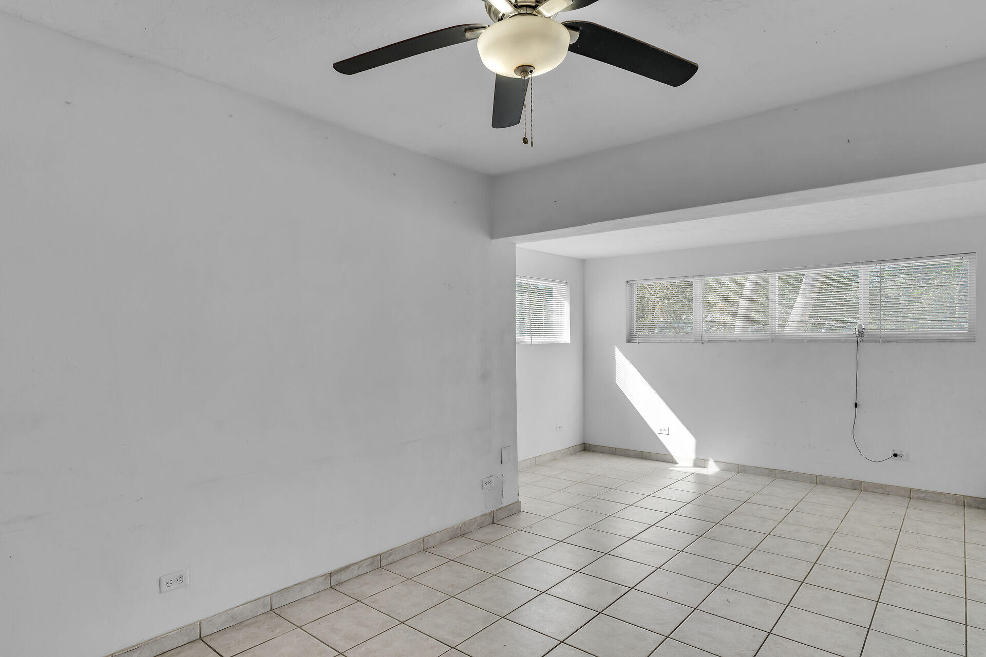 798 96th Street Marathon, FL 33050 - Photo 12 of 28 an empty room with windows and fan