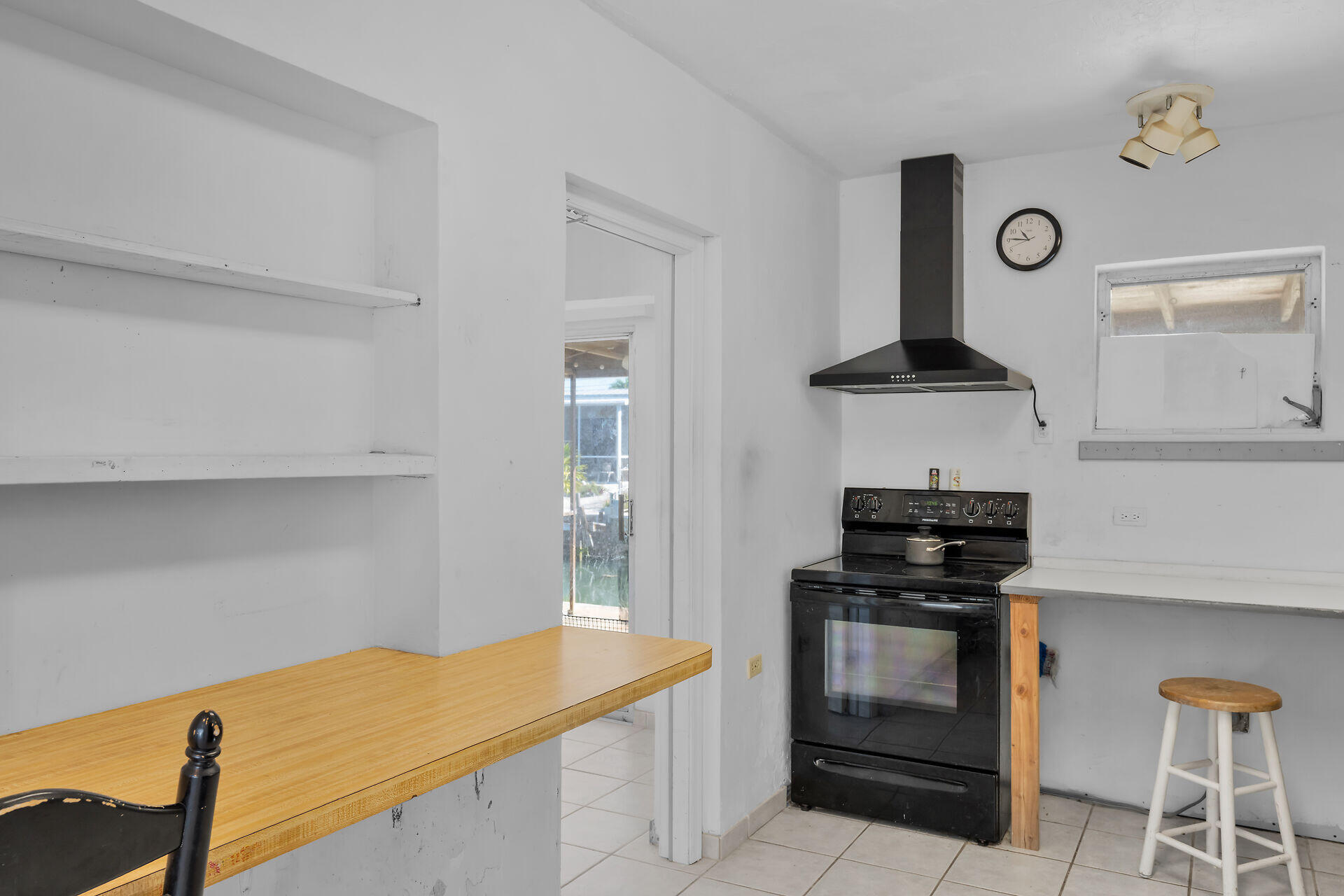 798 96th Street Marathon, FL 33050 - Photo 14 of 28 a kitchen with stainless steel appliances a stove and a refrigerator