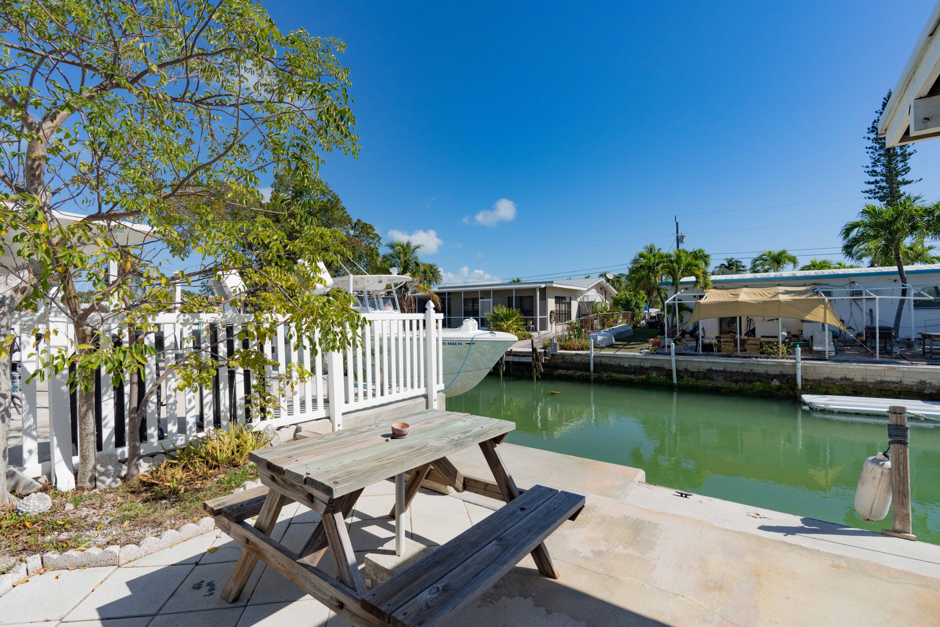 798 96th Street Marathon, FL 33050 - Photo 4 of 28 a view of a patio with chairs and a table