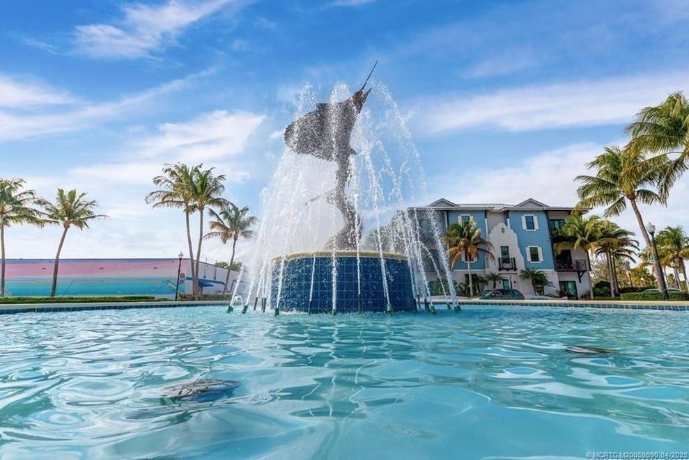 2950 Southeast Ocean Boulevard, Unit 66 Stuart, FL 34996 - Photo 18 of 18 a front view of a house with a yard