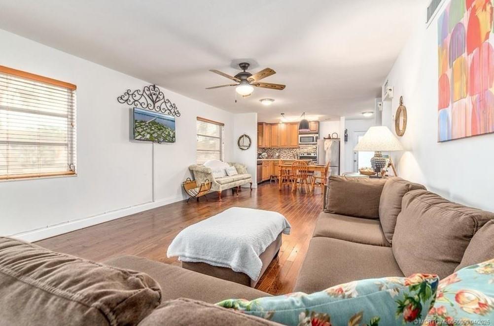 2950 Southeast Ocean Boulevard, Unit 66 Stuart, FL 34996 - Photo 6 of 18 a living room with furniture and a large window