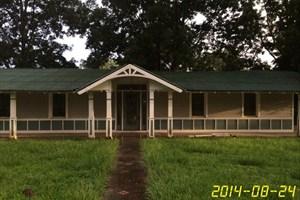 4233 Bob Sikes Road DeFuniak Springs, FL 32435 - Photo 1 of 5 a view of an house with backyard space and garden