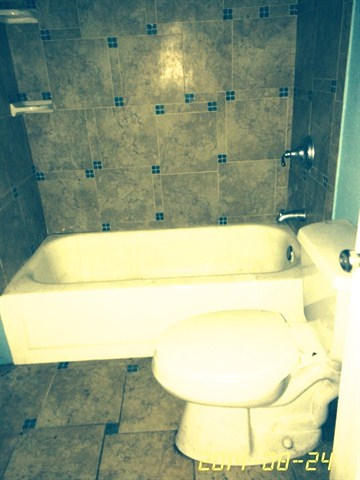 4233 Bob Sikes Road DeFuniak Springs, FL 32435 - Photo 5 of 5 a bathroom with a bathtub