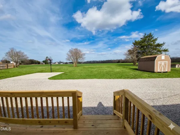 a view of a deck and a yard