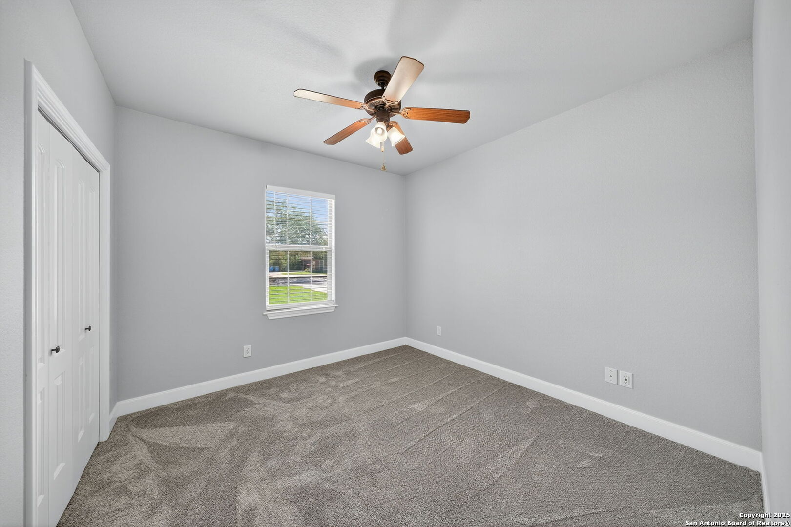 1626 Clover Ridge Pleasanton, TX 78064 - Photo 20 of 33 an empty room with windows and fan