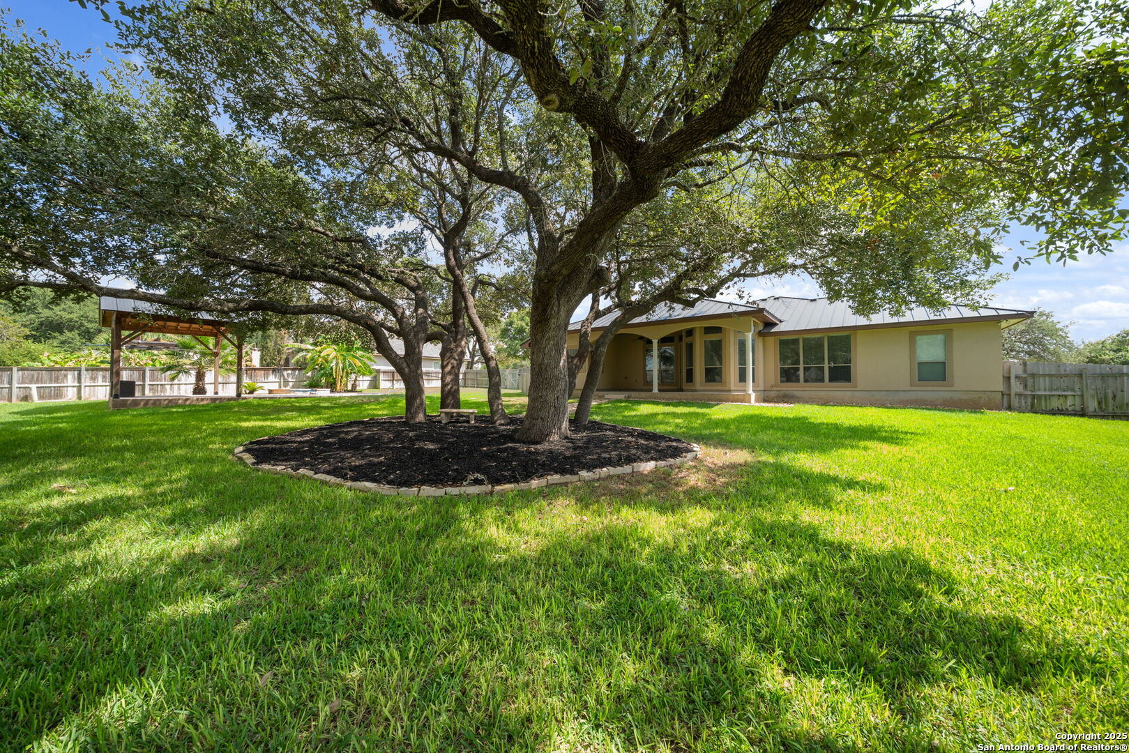 1626 Clover Ridge Pleasanton, TX 78064 - Photo 30 of 33 a view of house with a big yard and large trees
