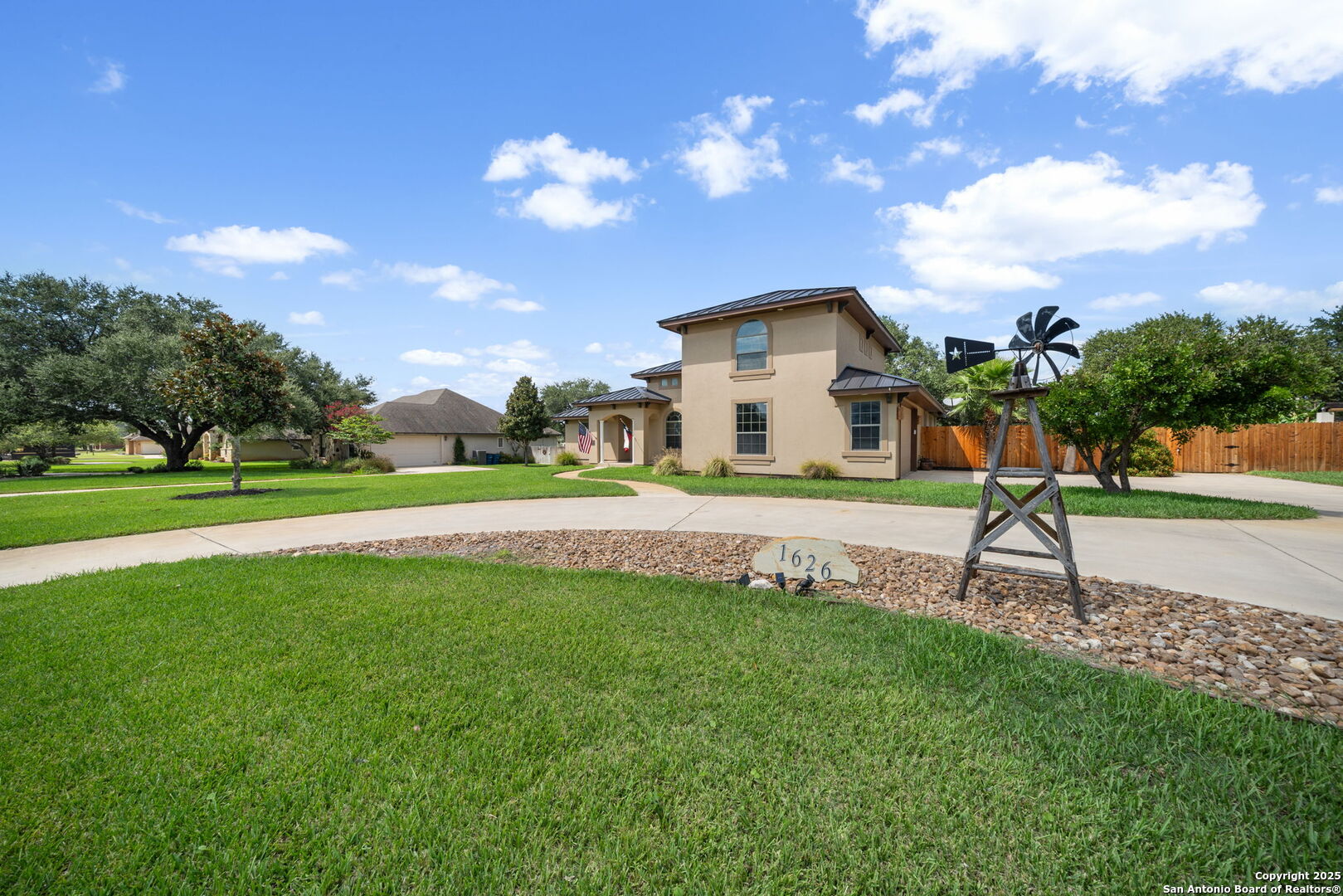 1626 Clover Ridge Pleasanton, TX 78064 - Photo 3 of 33 a view of a house with a yard and a garden