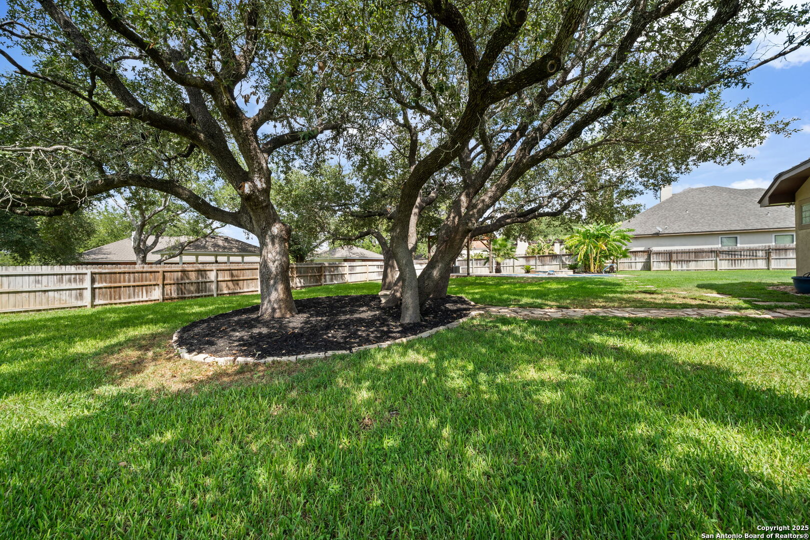 1626 Clover Ridge Pleasanton, TX 78064 - Photo 31 of 33 a view of a house with a big yard and large trees