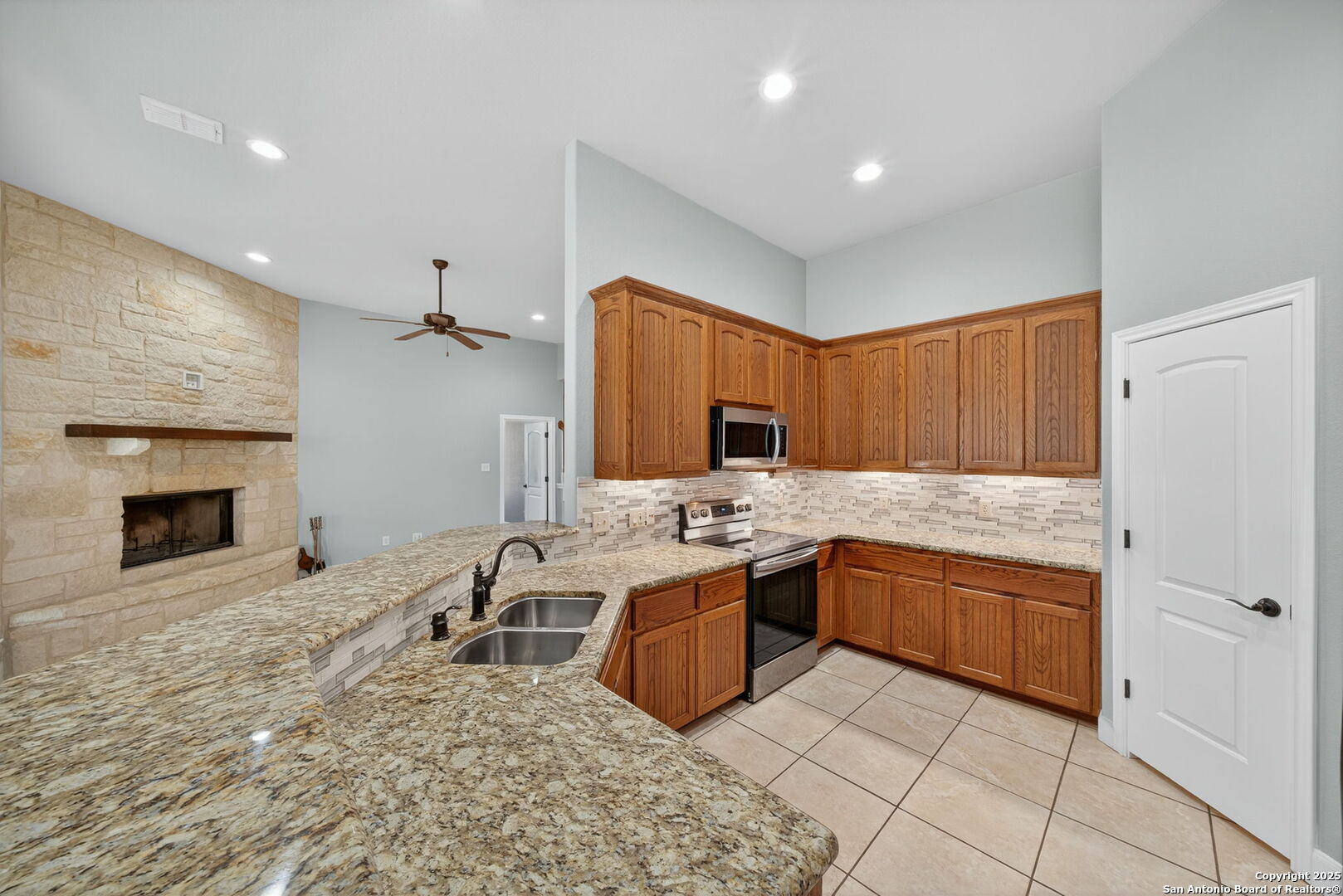 1626 Clover Ridge Pleasanton, TX 78064 - Photo 8 of 33 a kitchen with a sink and a stove top oven